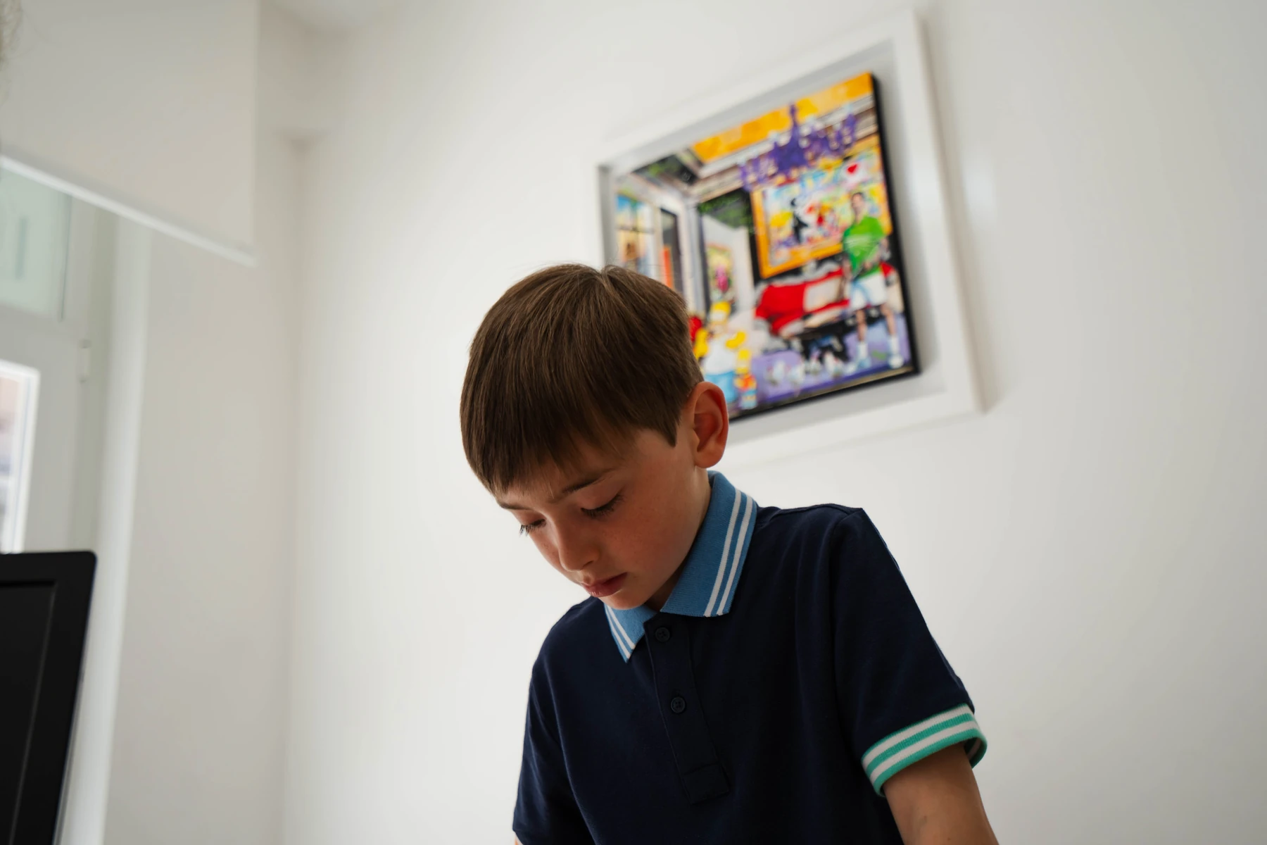 Child concentrating during a learning activity, speech and language therapy practice in Viterbo