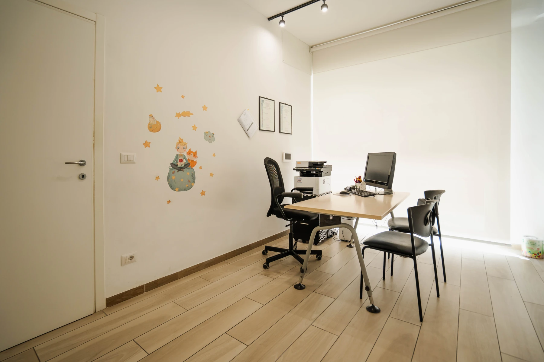 Consulting room at the speech and language therapy practice in Viterbo, with an orchid and natural light